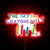 RGB neon sign with the phrase 'The Day the Crayons Quit' in bold, colorful letters