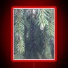 Neon sign with fir trees and tears amidst vibrant RGB colors