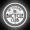 The logo of The Folding Bicycle Club, featuring a neon sign design in white and RGB colors.