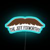 Neon Jeff Foxworthy sign in RGB colors at sunset.