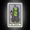 A colorful neon sign featuring Kermit the Frog from The Muppets, presented in a tarot card layout.