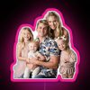 Neon pink LED sign with a classic labrant family logo design.