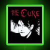 Neon sign reading 'The Man Cure' in red, green, and RGB colors.