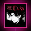 The neon sign reads 'The Man Cure' in bold, red text.