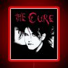 Neon red sign with bold, cursive font reading "The Man Cure