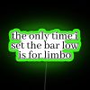 Neon sign with colorful letters spelling out a humorous quote about setting expectations low, referring to the game of limbo.