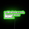 Neon sign reading 'The Perks of Being a Wallflower' in vibrant green letters.