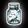 Neon sign with colorful, glowing letters reading "I try my best