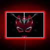 Neon sign with vibrant red glow in a dark background.