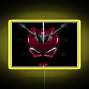 Neon sign with vibrant red and yellow hues in a dark alleyway