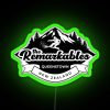 Neon sign with The Remarkables mountain range in black and RGB colors, illuminated at night.
