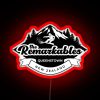 Neon sign reading 'The Remarkables' in bold, black letters with RGB neon lights illuminated at night.