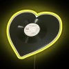 Neon sign with vibrant yellow letters spelling out 'The Smiths' in bold, cursive font on a vinyl background.