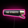 The Streets neon logo on a pink background