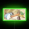 Beatrix Potter's classic character illustration on a neon sign with a whimsical, colorful design.