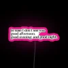 Neon sign reading 'The Truman Show' in pink, with RGB lighting effects.