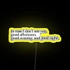 Neon sign reading 'The Truman Show' in bright yellow lights against a dark background.