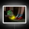 Close-up of Ruby Slippers from The Wizard of Oz in front of a neon sign