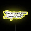 There are many worse games to play" quote on a neon sign with a yellow background.