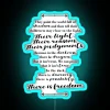 Neon sign with colorful text that reads 'There is Freedom'