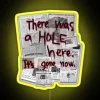 Neon sign with a phrase 'There was a hole here, it's gone now'