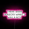 RGB neon sign with a nostalgic illustration of dragons in pink hues, evoking a sense of childhood wonder.