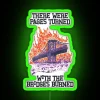 Abandoned highway with neon-lit sign reading 'There Were Pages Turned With The Bridges Burned'