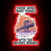 Neon sign with phrase 'There were pages turned with the bridges burned' in bold red letters against a dark background.
