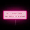 Car bumper with the phrase 'These curbs aren't gonna hit themselves funny'
