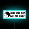 Vibrant neon sign reading 'Thick Dads 4 Christ'