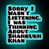 Shah Rukh Khan neon sign in blue with bold, cursive font, reflecting on his career.