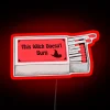 This witch doesn't burn" neon sign.