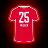 Thomas Müller standing in front of a neon Munich sign at Allianz Arena, Germany.