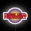 Neon sign reading 'Threat Level Midnight' in a dark background.