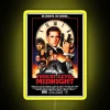 Neon sign reading Threat Level Midnight in classic RGB colors, illuminated at midnight.