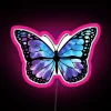 Tie-dyed butterfly neon sign in pink hues