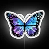 Vibrant tie-dye butterfly illuminated against a neon-colored background on a white sign.