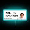 Neon sign with colorful, futuristic letters spelling out 'Take Out The Trash'
