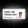 Neon sign reading 'Take out the trash'
