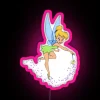 Tinker Bell with her wand in neon pink, illuminated by RGB lights