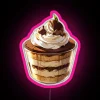 Neon sign with colorful, vibrant lettering reading "Tiramisu Cake" in pink and RGB colors.