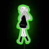Girl walking under a vibrant neon sign with green accents in a city street at night.