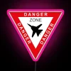 Neon pink sign warning of danger zone with a Tomcat F-14 jet silhouette