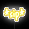 Neon sign reading 'Tommy's Soda Sip' in RGB color scheme, glowing brightly against a white background.