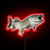 Neon sign with cartoonish, smiling muskellunge fish in bright colors.