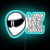 The Top Gear Stig's iconic racing helmet under a vibrant RGB neon sign