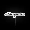 Toyota Supra logo illuminated by neon lights in white color