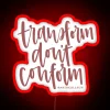 Neon sign reading 'Transform Don't Conform' in red.