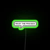 Neon sign with the phrase 'Trust the Process' in green letters, conveying confidence and determination.