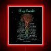 Neon sign with tree and DNA helix pattern in black, red, and RGB colors.